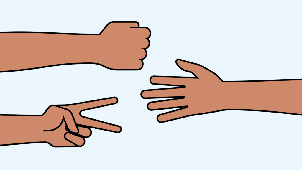 Hands playing rock-paper-scissors game.
