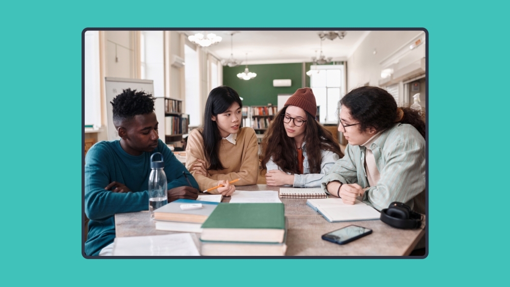 Group of high school students studying in a library