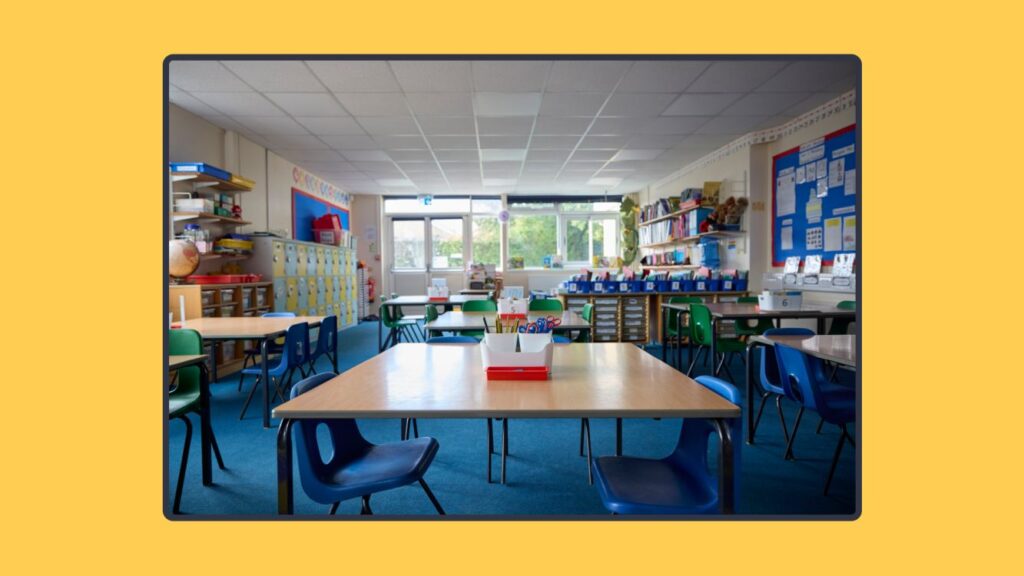 A well-organized classroom with student desks, chairs, and learning materials