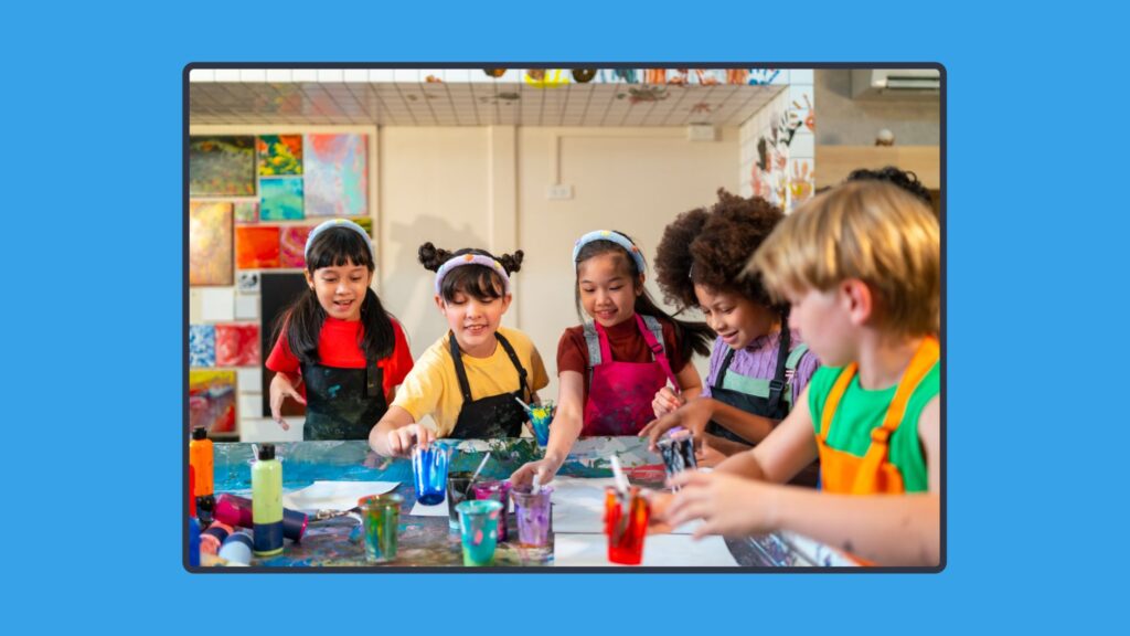 Students painting together in an art classroom