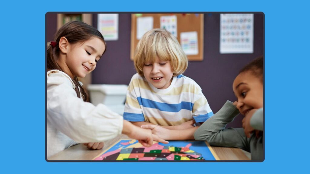 Elementary students playing a geography puzzle in class.