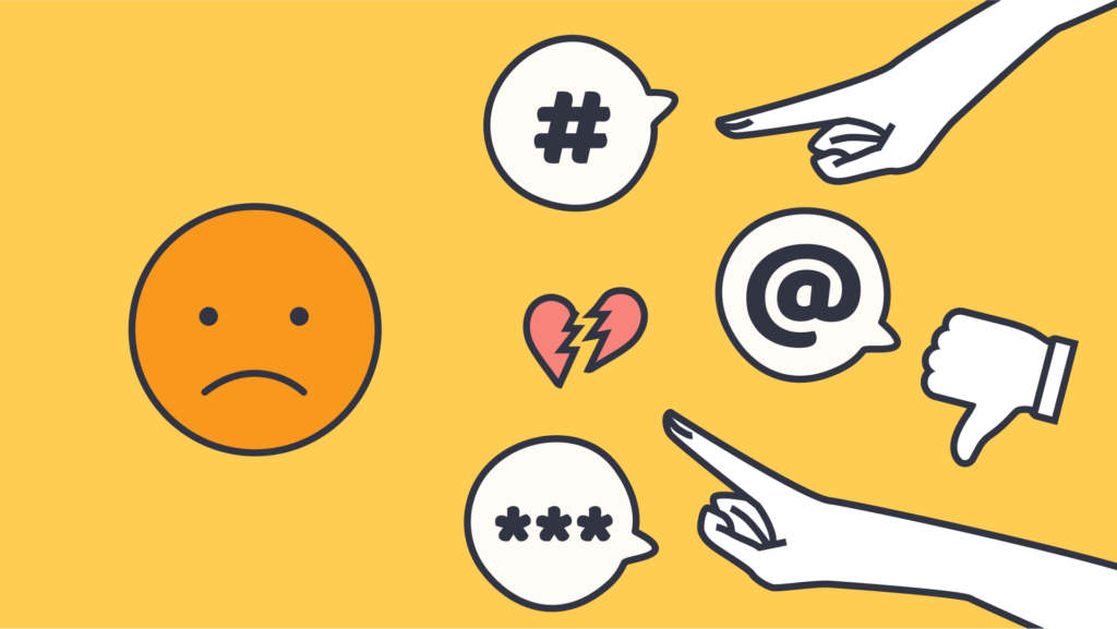 An illustration of hands pointing at a sad face with speech bubbles of a hashtag, an at sign, and asterisks.